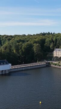 The Lac des Settons dam and lakeshore in Morvan, France, aerial vertical 9:16 view.