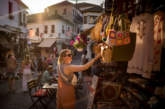 A woman shopping in the UNESCO village of Gjirokast&euml;r in the mountains of Albania.