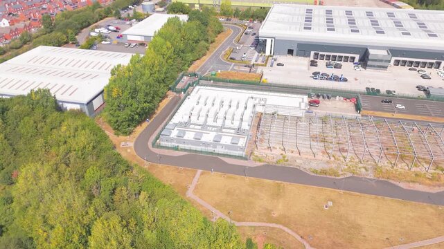 A close orbit of a modern data centre with ultra low power usage effectiveness cooling infrastructure components on the roof
