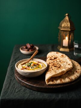 Traditional Middle Eastern flatbread with fresh tomatoes and herbs.