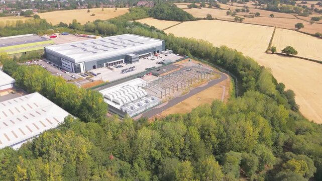 A far orbit of a modern data centre in South Birmingham showing how it sits in a rural landscape