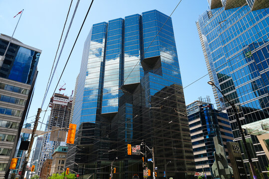 Toronto, Canada - June 23, 2026: Modern glass skyscrapers and urban street scene in downtown financial district