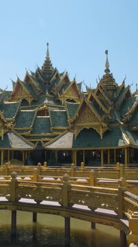 Traditional Thai temple connected by wooden bridges over water in Ancient City, Bangkok city, Thailand. Pavilion of the Enlightened in Ancient Siam. Architecture with traditional design