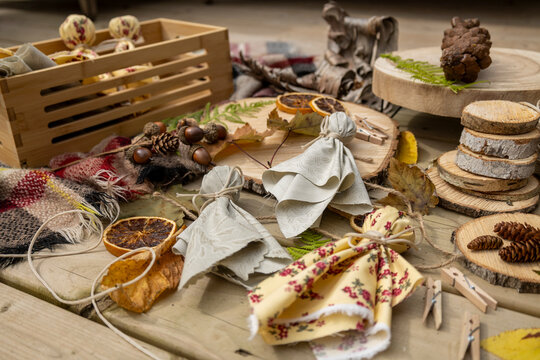 Rustic Fall Craft Supplies and Handmade Autumn Decorations with Dried Oranges, Pinecones and Fabric
