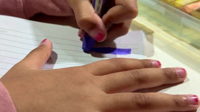 Child's hand carefully coloring picture with crayon, close up shot, kids art and craft, creative learning activity, colorful artwork.