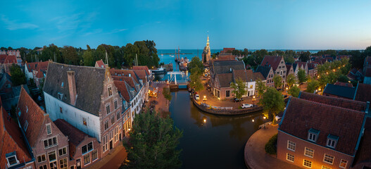 Panorama of Hoorn harbor canal and Hoofdtoren at dusk © Thomas