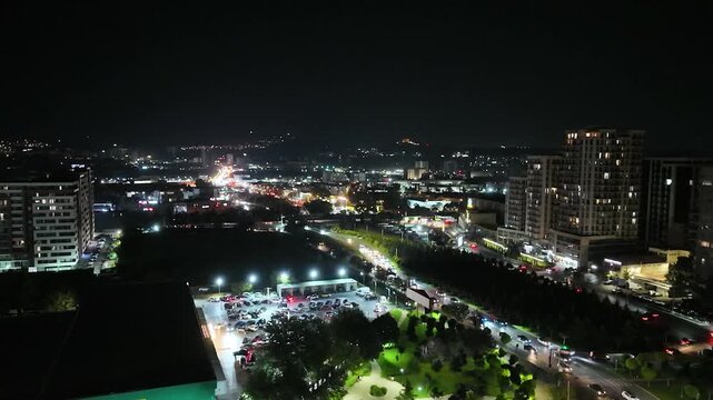 Lights gradually returning to normal in an urban area after a power outage, aerial view.