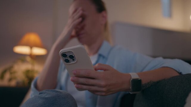 Woman anxiously scrolling through negative news on her smartphone at night, showing digital stress, doomscrolling, excessive screen time, information overload and emotional exhaustion.