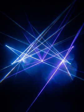 Blue and violet laser light beams on black background, abstract electronic prism diffraction overlay, futuristic technology backdrop