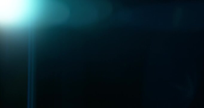 Cinematic moving lens flare overlay in super slow motion featuring glow, soft optical reflections and realistic lens artifacts on a black background. Premium VFX element for compositing.