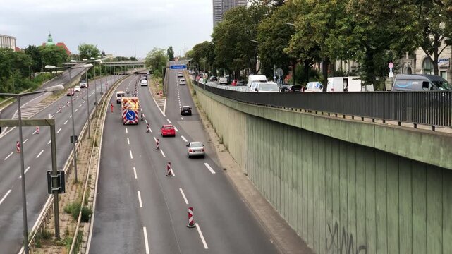 Traffic management trailer with illuminated arrow on Berlin A100 motorway