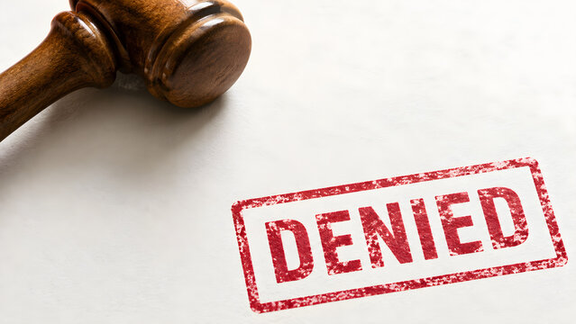 Wooden judge gavel with denied stamp on white background symbolizing legal rejection court decisions authorization refusal compliance and justice