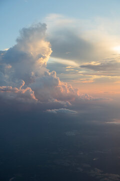 Puffy clouds at sunset aerial view