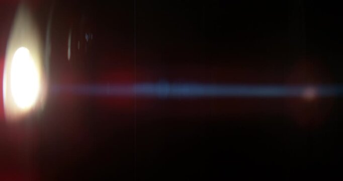 Cinematic moving lens flare overlay in super slow motion featuring glow, soft optical reflections and realistic lens artifacts on a black background. Premium VFX element for compositing.