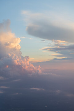 Puffy clouds at sunset aerial view