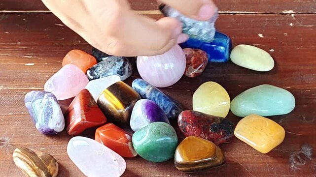 Natural minerals in hand. Semi-precious multi-colored stones, minerals close-up. Mineralogy. Collection of minerals.	