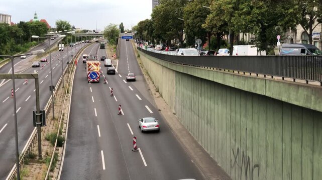 Traffic management trailer with illuminated arrow on Berlin A100 motorway