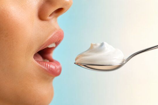 Woman About to Taste a Spoonful of Creamy Yogurt