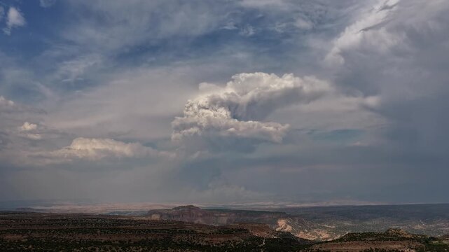 Aerial view of a massive pyrocumulus cloud forming from the Frijoles wildfire over the arid landscape in White Rock, NM, United States.