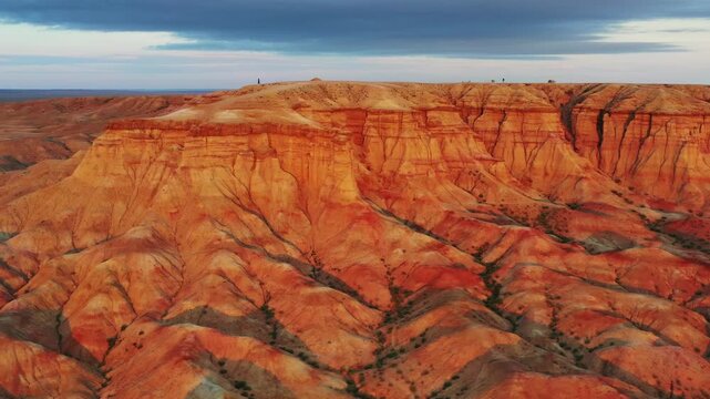 Aerial view of the dramatic red and orange sedimentary rock formations of Tsagaan Suvarga in the Gobi Desert near O'lziit, Dundgovi, Mongolia.