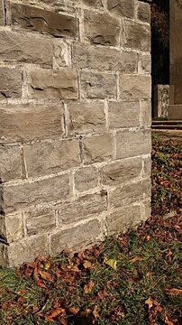 Brick wall with a stone pillar