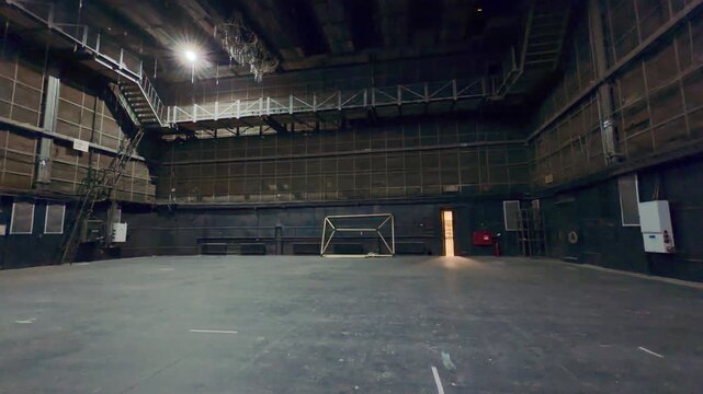 A dark empty soundstage stands illuminated inside Lenfilm in Saint Petersburg. This massive industrial film studio inspires a deep feeling of mystery and cinematic wonder.