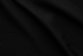 Fototapeta premium Close-up of Elegant Black Fabric Texture with Soft Folds and Drapery