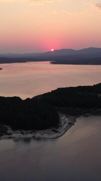 Total solar eclipse sunset over Cuerda del Pozo Reservoir in Soria