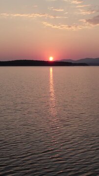 Total solar eclipse sunsetting over Cuerda del Pozo Reservoir in Soria