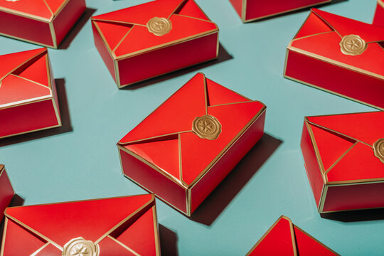 Red gift envelopes with gold seals on blue background