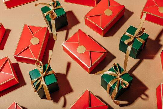 Bright holiday gift boxes and red envelope arrangement