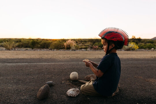 Autumn Portrait of a Boy Playing on Desert Path
