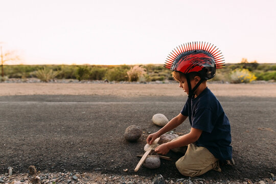 Fall Portrait of a Boy Playing on Desert Path