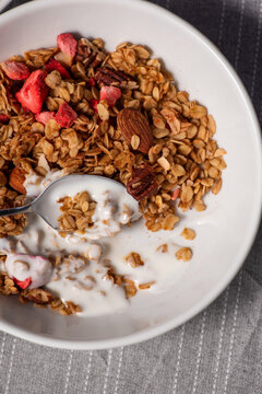 Granola breakfast with yogurt, almond, pecan and strawberry