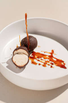 Syrok curd dessert with dark chocolate and caramel sauce
