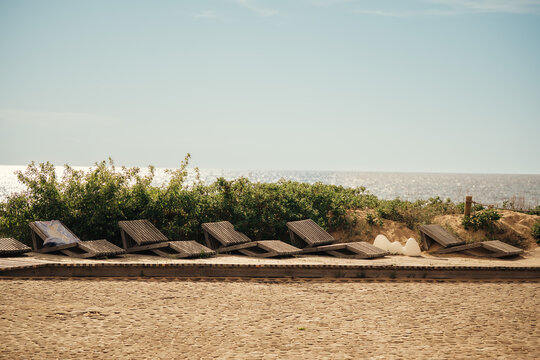 Empty sun loungers on summer beach in Saulkrasti, Latvia