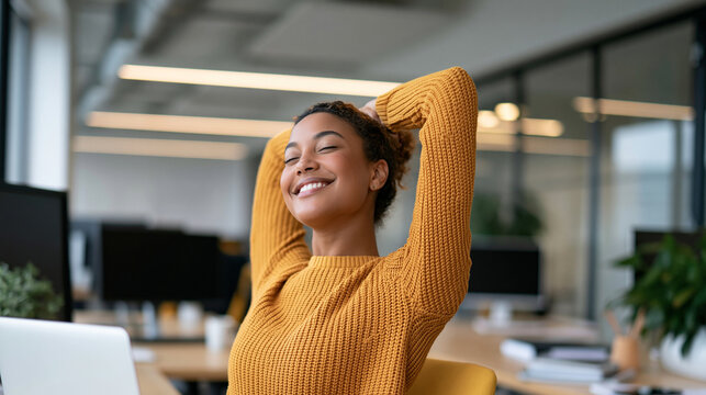 Woman stretching both arms beside her office desk, workplace wellness, stress relief, healthy work break, employee wellbeing, ergonomic habits, productivity lifestyle, bright