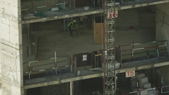 Industrial elevator going upwards at building construction site. Modern building process