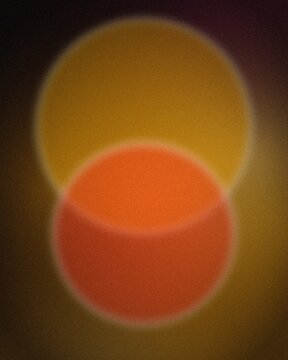 Vibrant orange and yellow gradient light burst with soft glow for modern design backgrounds