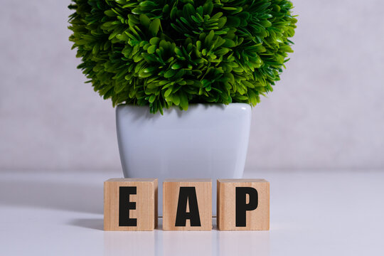Employee assistance program EAP sign on wooden cubes