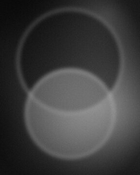 Glossy black ceramic ring isolated on dark gradient background for luxury product display