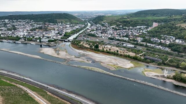 Confluence of Nahe and Rhine River at Bingen, Germany - Visible rocks and sandbars due to extraordinary low water level after a long period of drought - aerial view