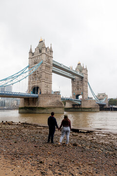 Couple viewing Tower Bridge over River Thames in London