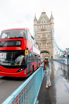 Red double-decker bus at Tower Bridge in London