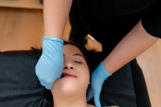 Facial osteopathy massage treatment at wellness clinic