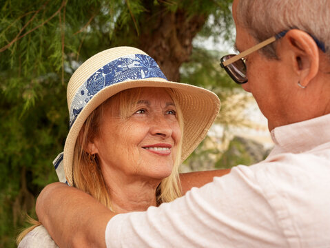 Senior couple share a loving moment outdoors