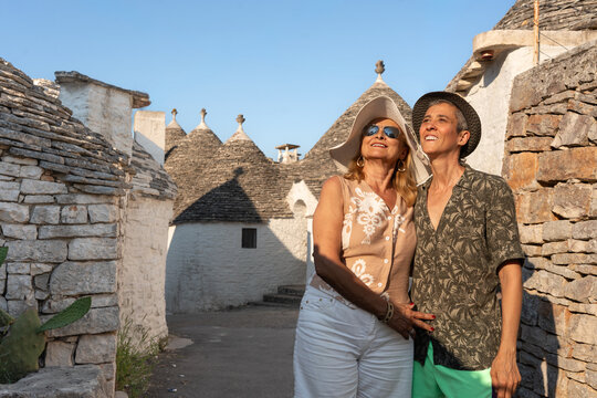 Mother and daughter explore Alberobello trulli on retirement trip