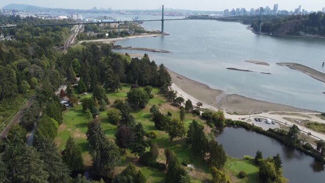 drone forward aerial Ambleside Park Pitch and Putt Golf Lionsgate Bridge