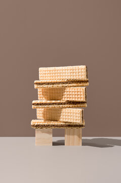 Chocolate-filled wafer cookies balanced on wooden blocks