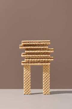 Chocolate wafer cookies stacked on wafer biscuit pillars